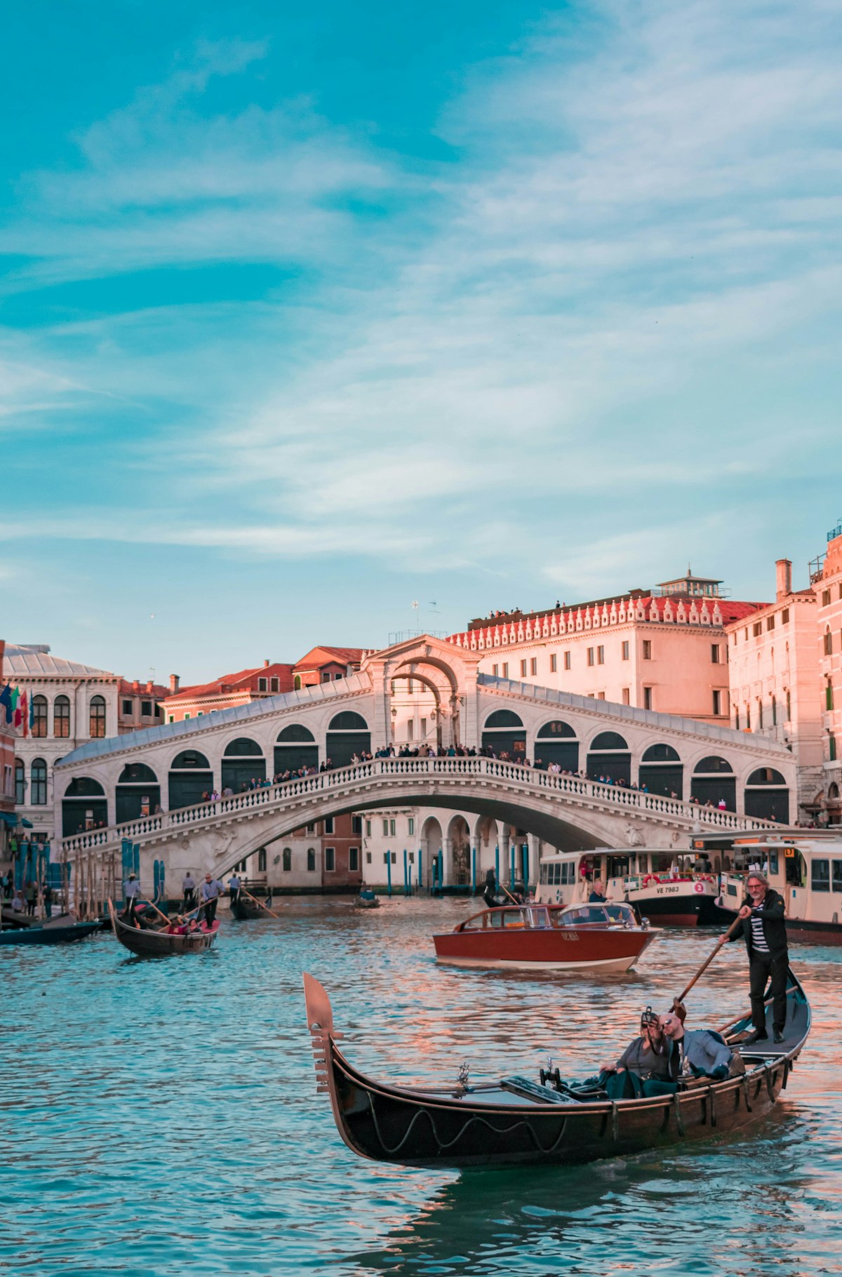 Venice grand canal with gondolas beneath the Rialto bridge